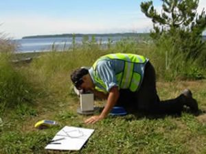 Graduate student James Taylor collecting gravity data on Washington’s west coast.